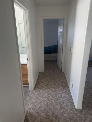 a view of a backyard with swimming pool