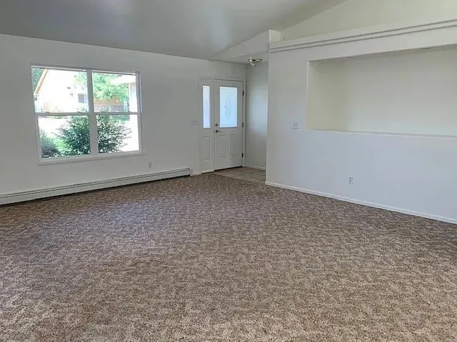 an empty room with windows