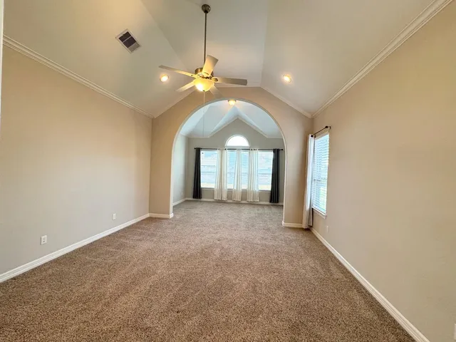 a white bath tub sitting next to a shower