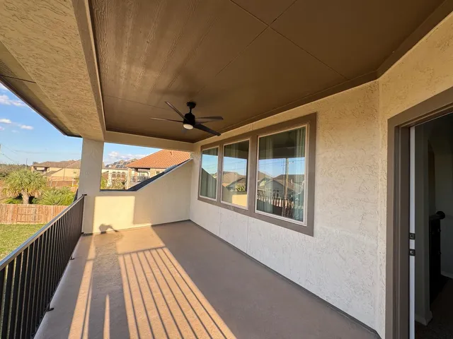 a view of a backyard with seating area