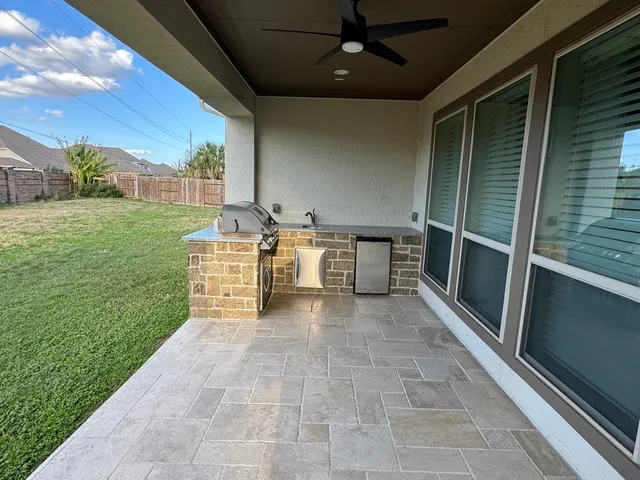 a front view of a house with a large window