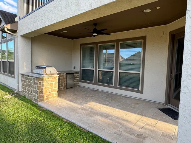 a view of brick house with a large window