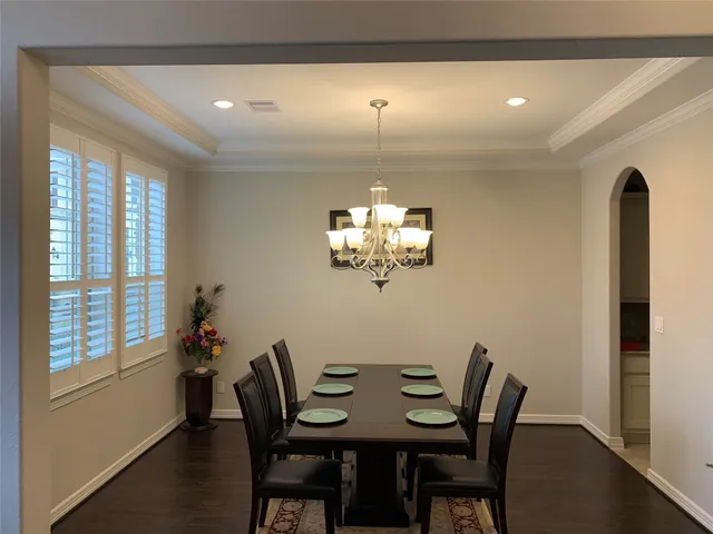 a view of a dining room with furniture and window