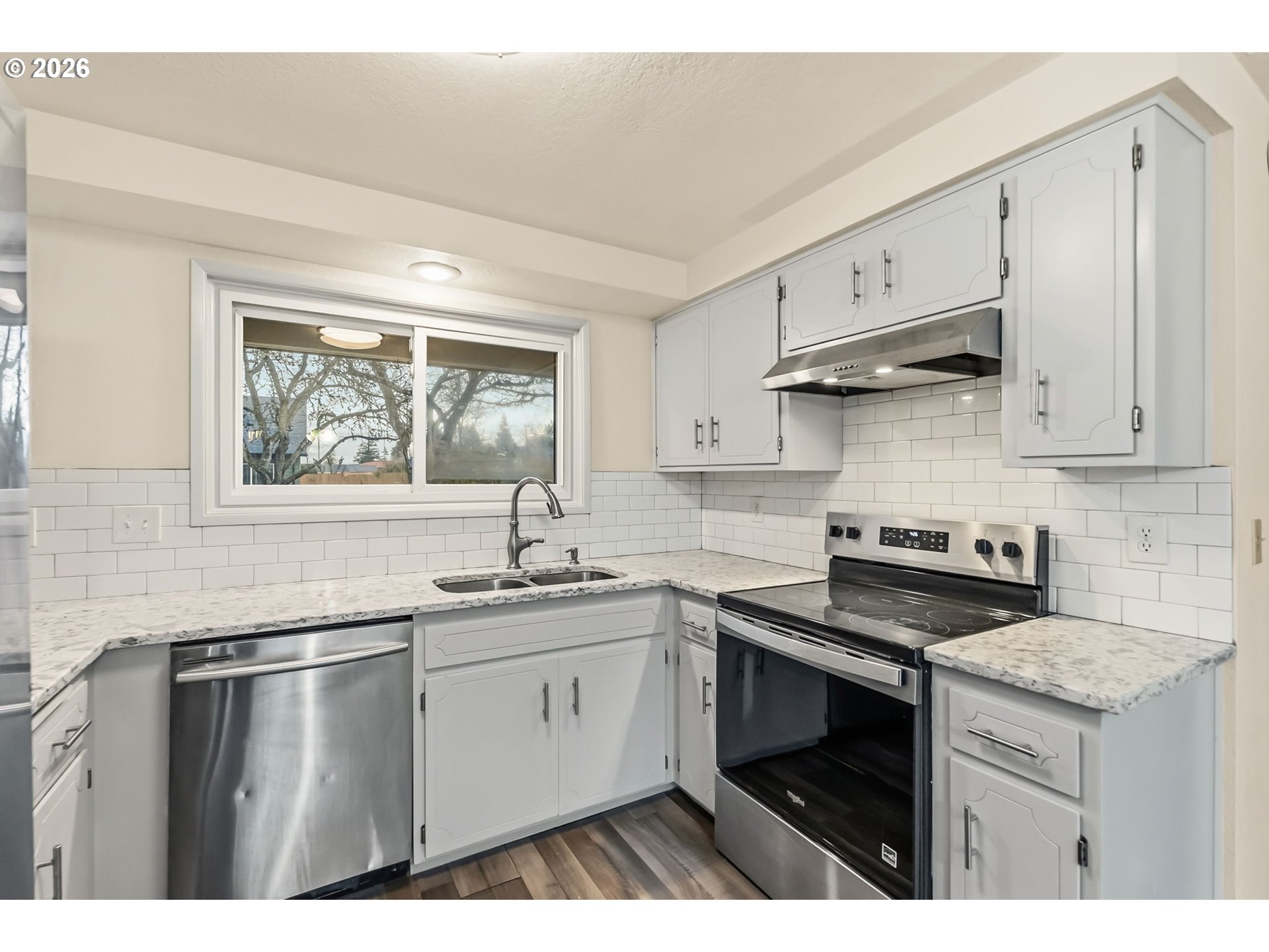 446 Kodiak Street Eugene, OR 97401 - Photo 13 of 34 a kitchen with stainless steel appliances granite countertop a sink stove and refrigerator