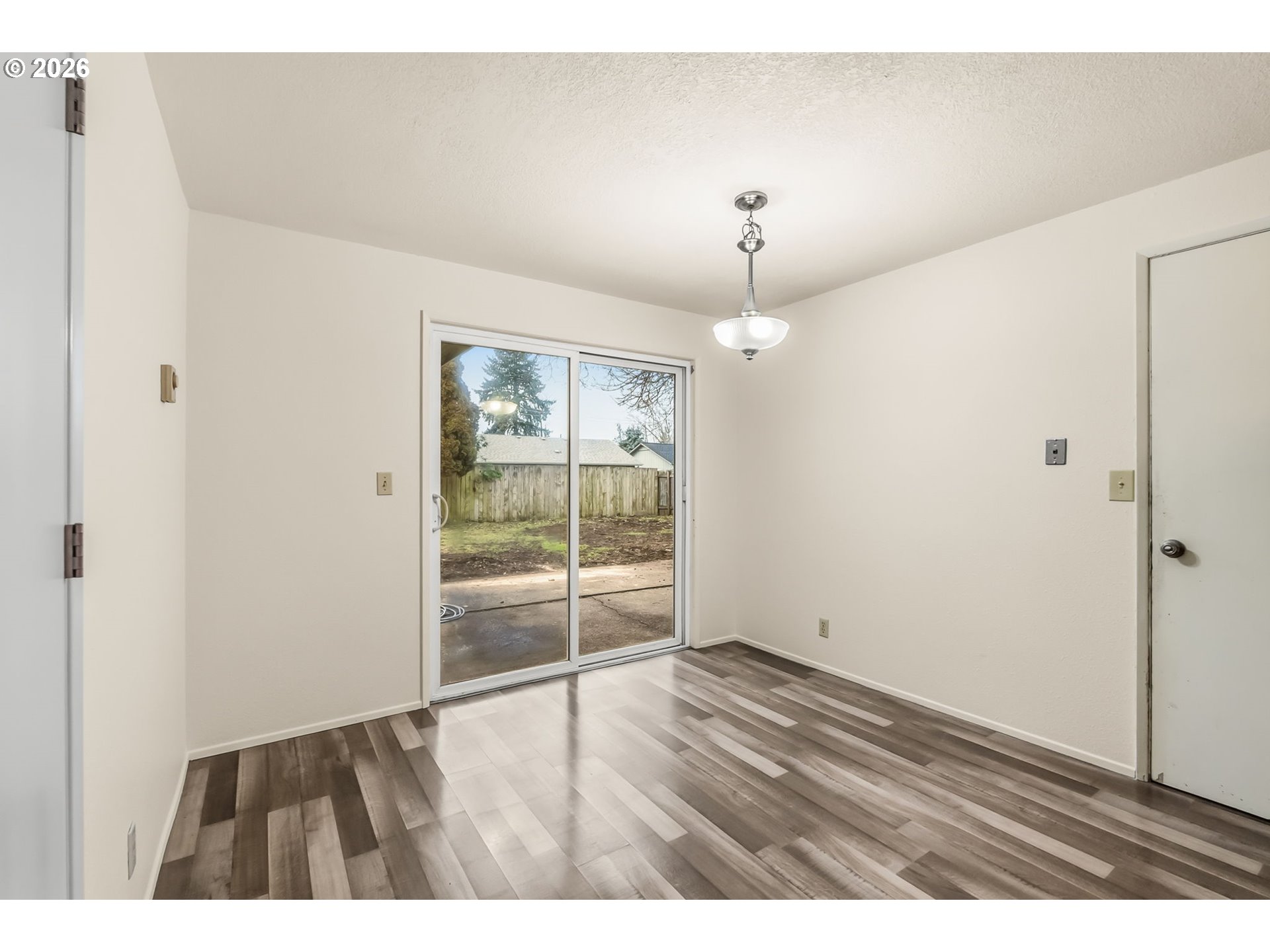 446 Kodiak Street Eugene, OR 97401 - Photo 15 of 34 a view of an empty room with wooden floor and a window