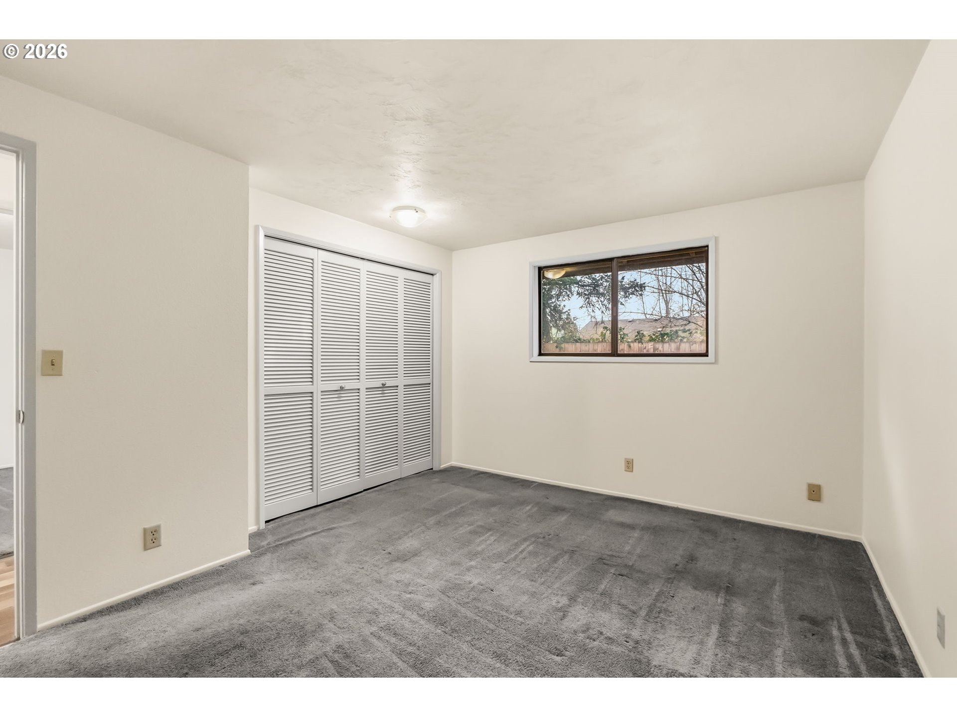 446 Kodiak Street Eugene, OR 97401 - Photo 17 of 34 an empty room with windows and closet