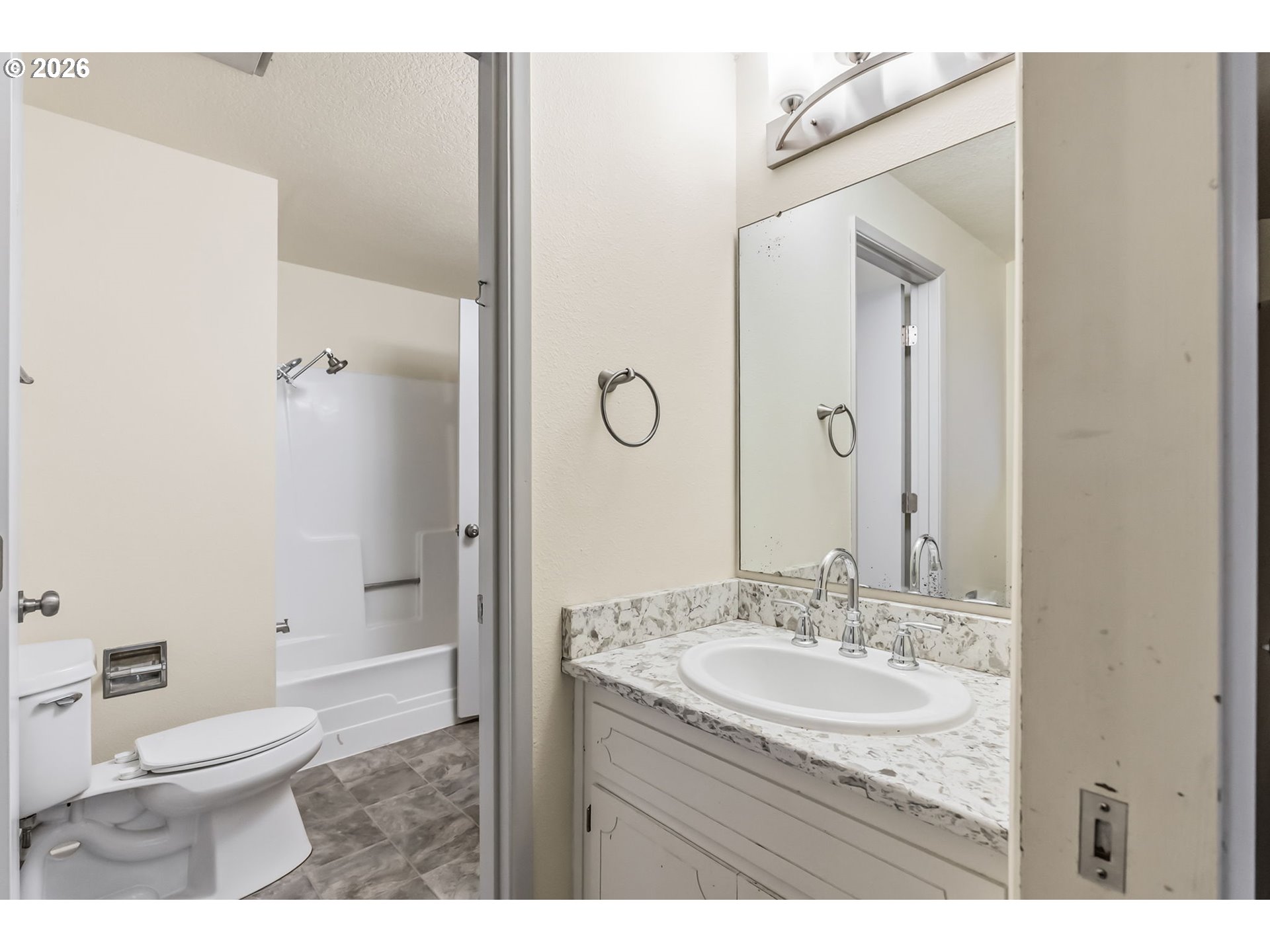 446 Kodiak Street Eugene, OR 97401 - Photo 19 of 34 a bathroom with a granite countertop sink toilet and shower