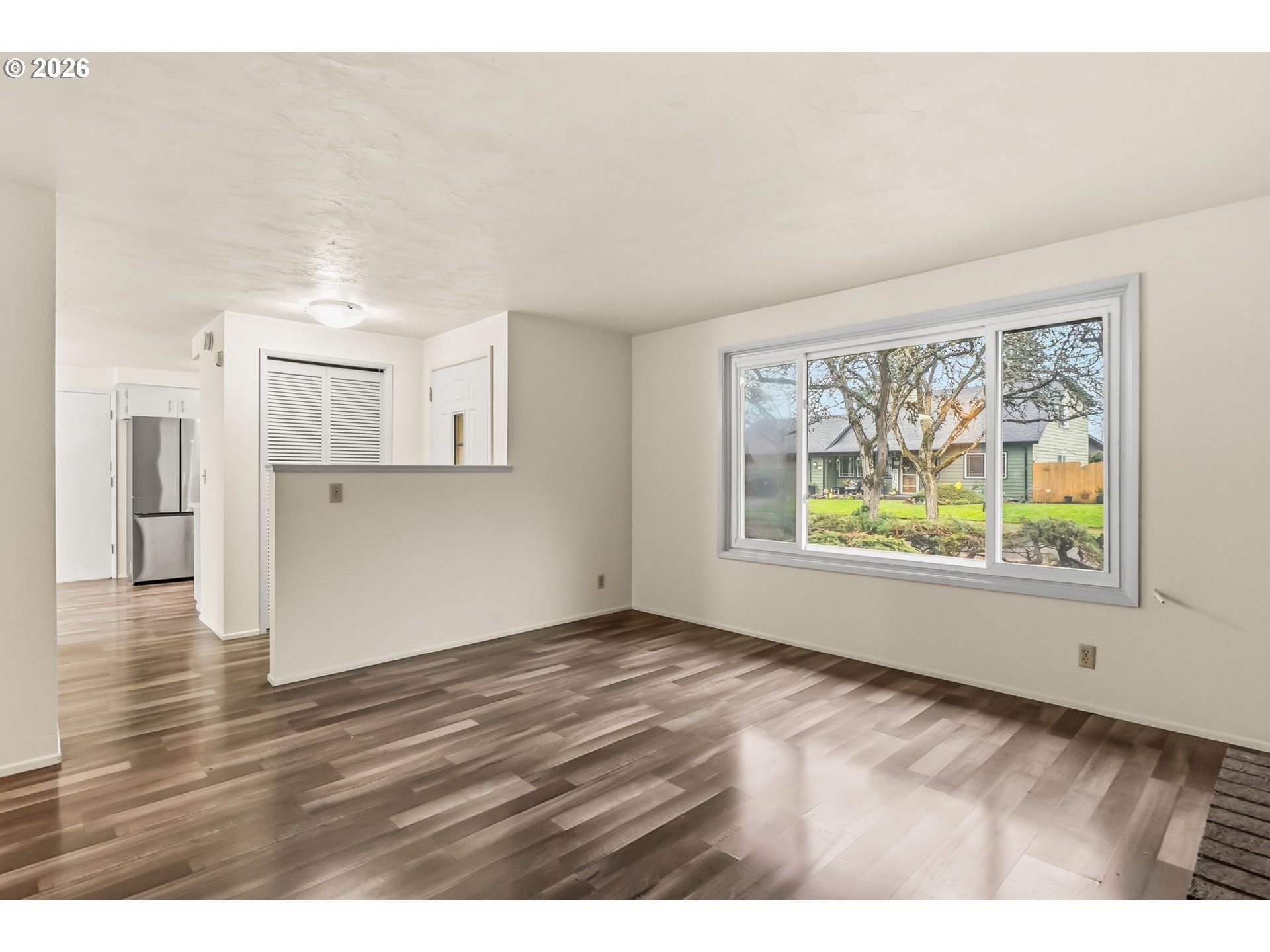 446 Kodiak Street Eugene, OR 97401 - Photo 9 of 34 a view of an empty room with wooden floor and a window