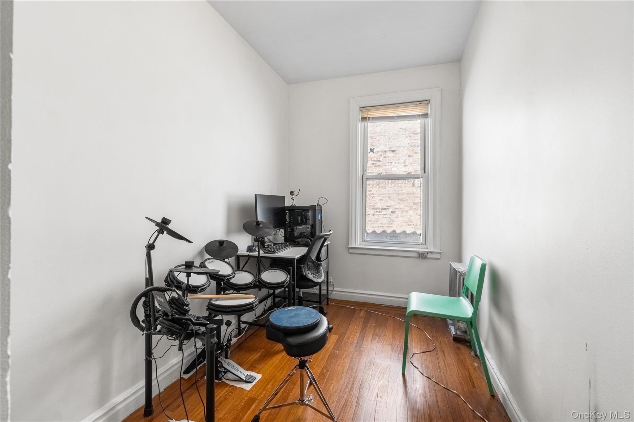 2969 Perry Avenue Bronx, NY 10458 - Photo 18 of 36 a view of a dining room with furniture and wooden floor