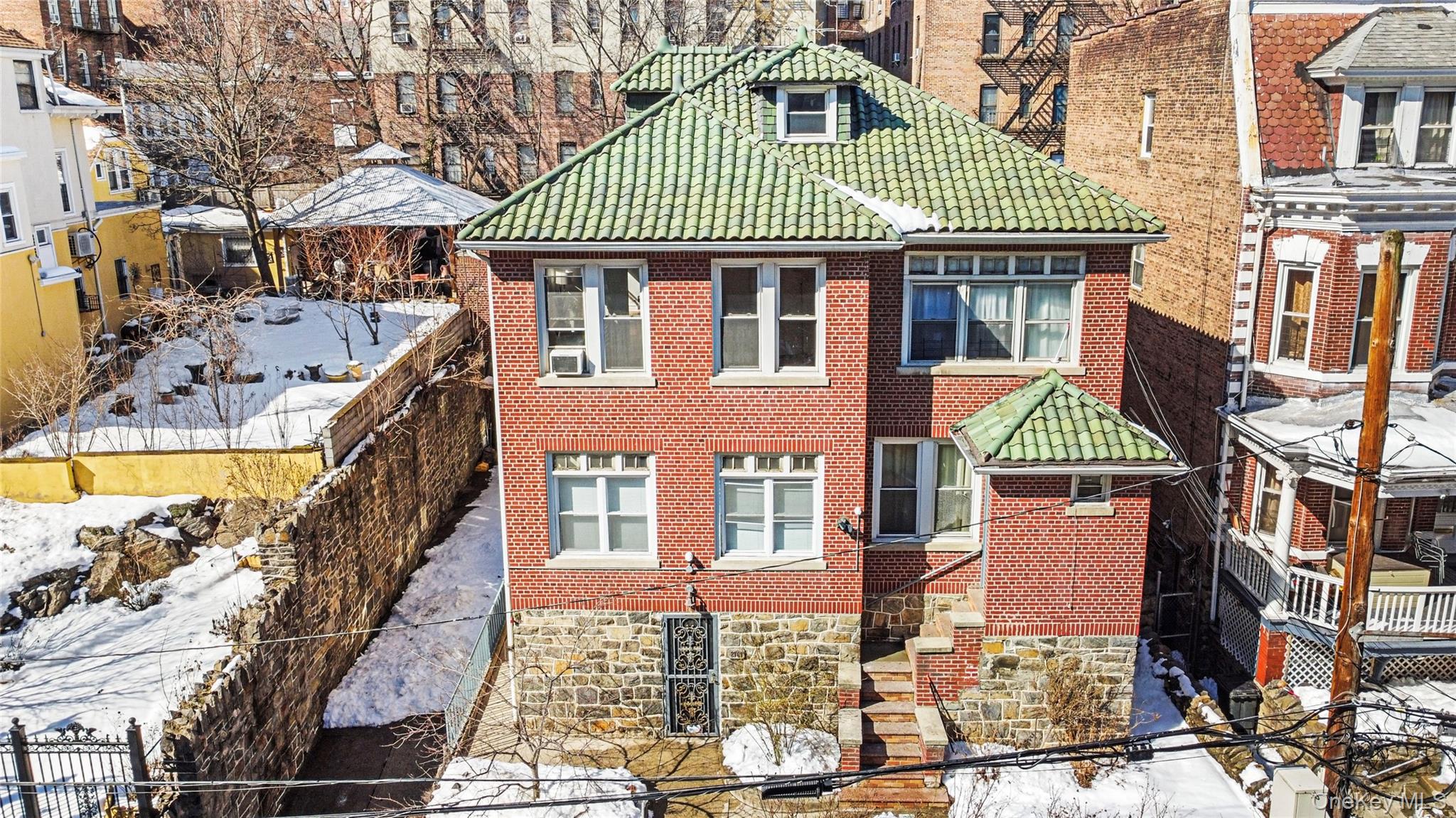 2969 Perry Avenue Bronx, NY 10458 - Photo 2 of 36 a front view of a residential apartment building with a yard