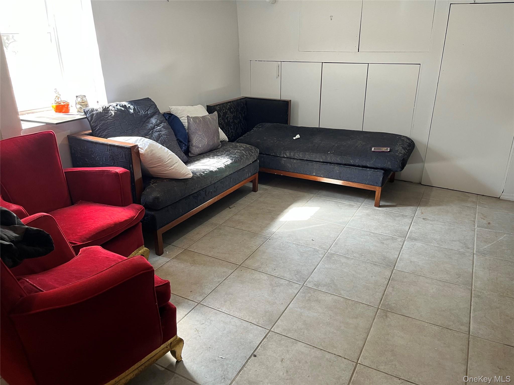 2969 Perry Avenue Bronx, NY 10458 - Photo 33 of 36 a living room with furniture and a couch