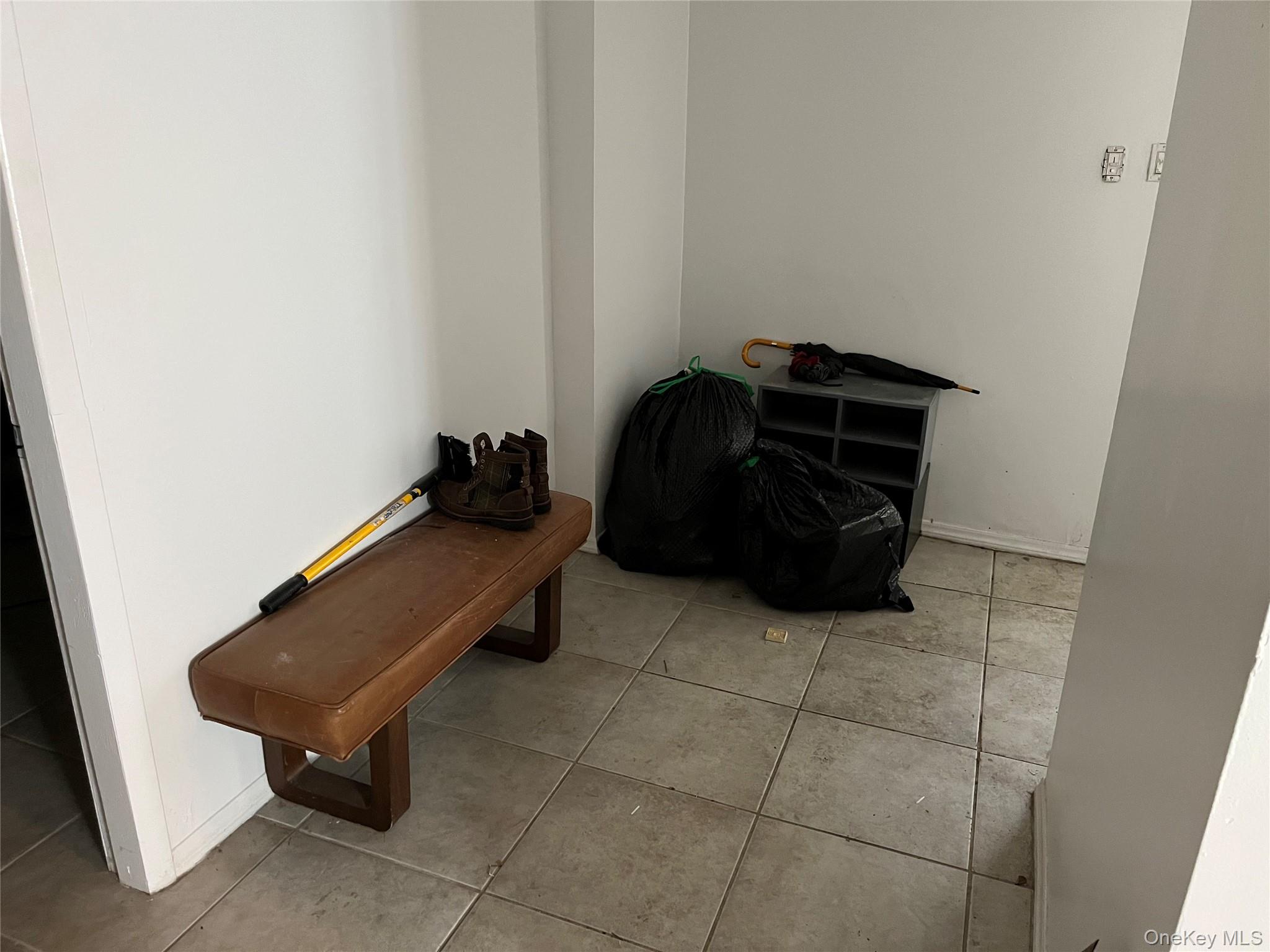 2969 Perry Avenue Bronx, NY 10458 - Photo 36 of 36 a room with a black and white wall