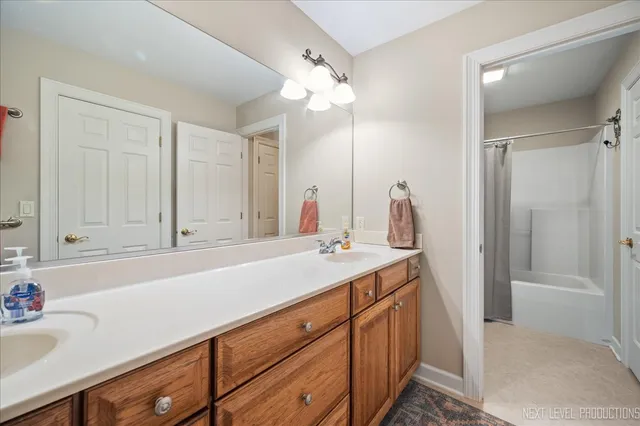 a room that has a bed and a chair in it