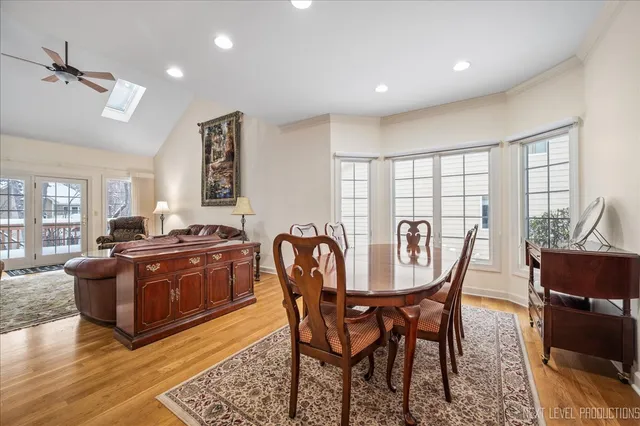 a living room with furniture a large window and a table