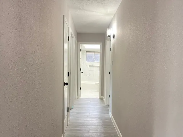 a view of a bathroom from a hallway