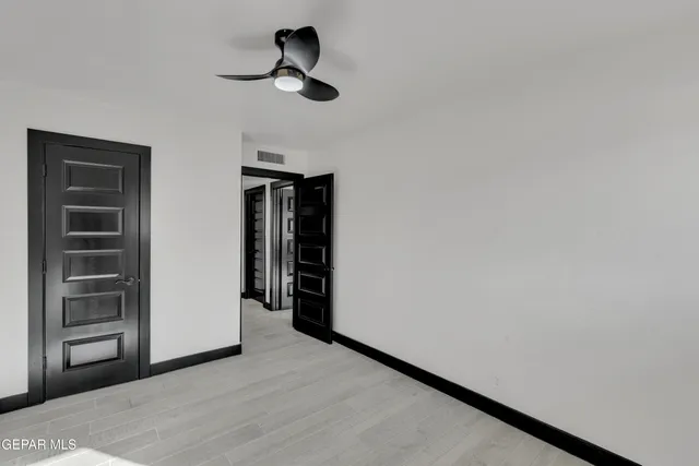 a view of empty room with closet