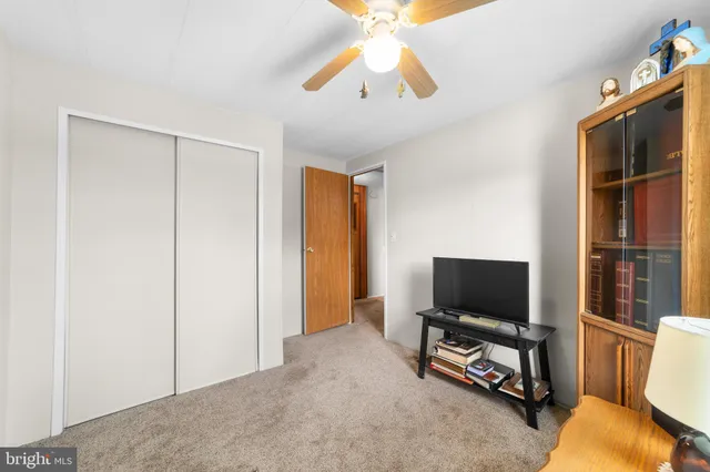 a view of a livingroom with furniture and a flat screen tv