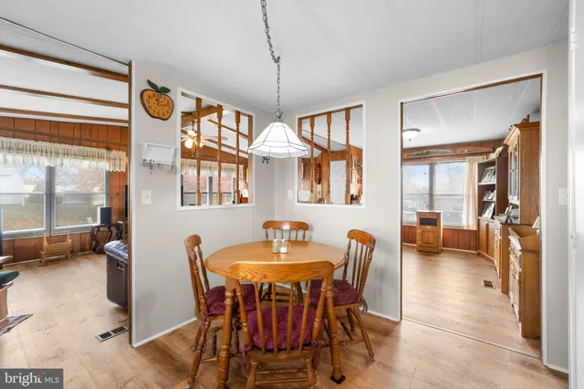 a dining room with furniture and window