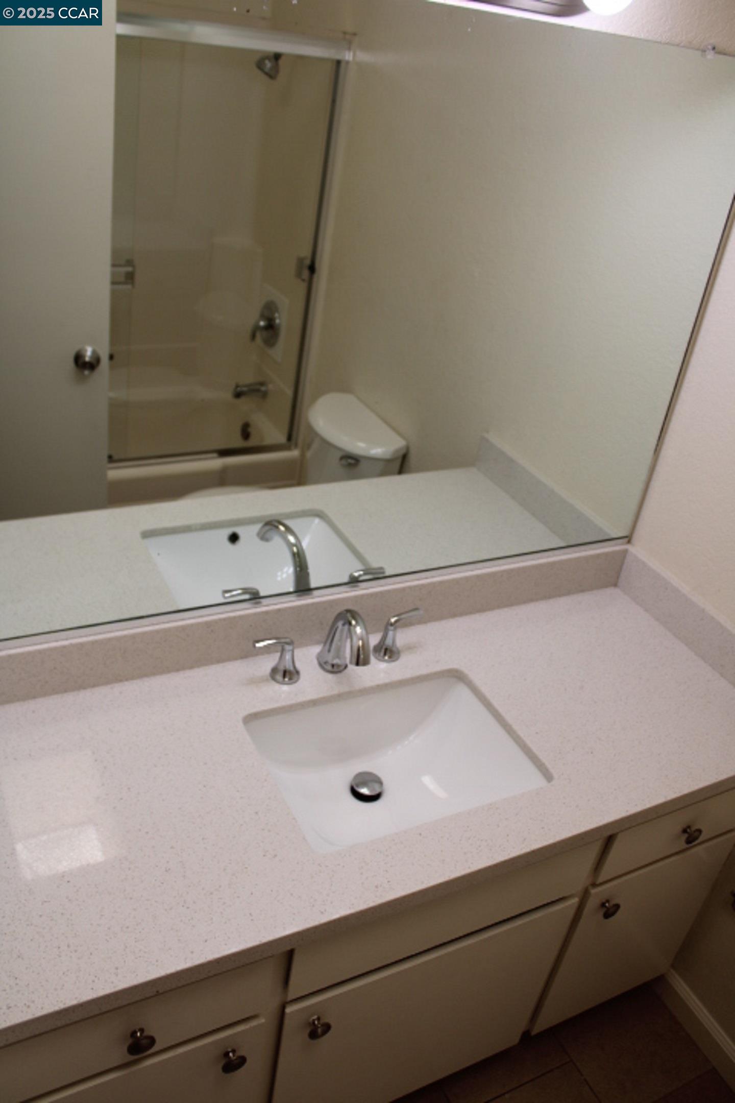 4811 Appian Way, Unit 3/5 El Sobrante, CA 94803 - Photo 17 of 27 a bathroom with a sink and a mirror