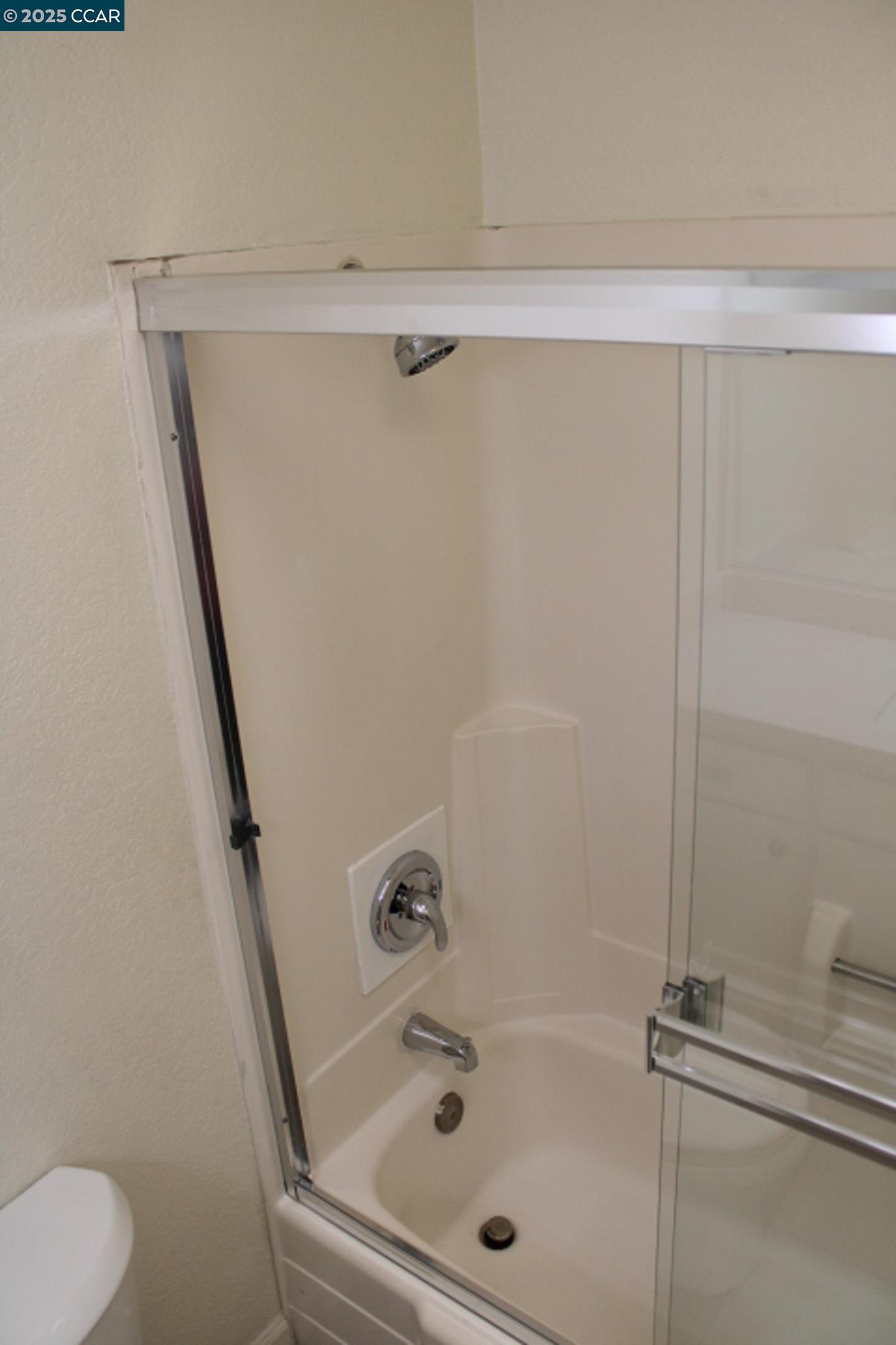 4811 Appian Way, Unit 3/5 El Sobrante, CA 94803 - Photo 18 of 27 a bathroom with a tub and a shower