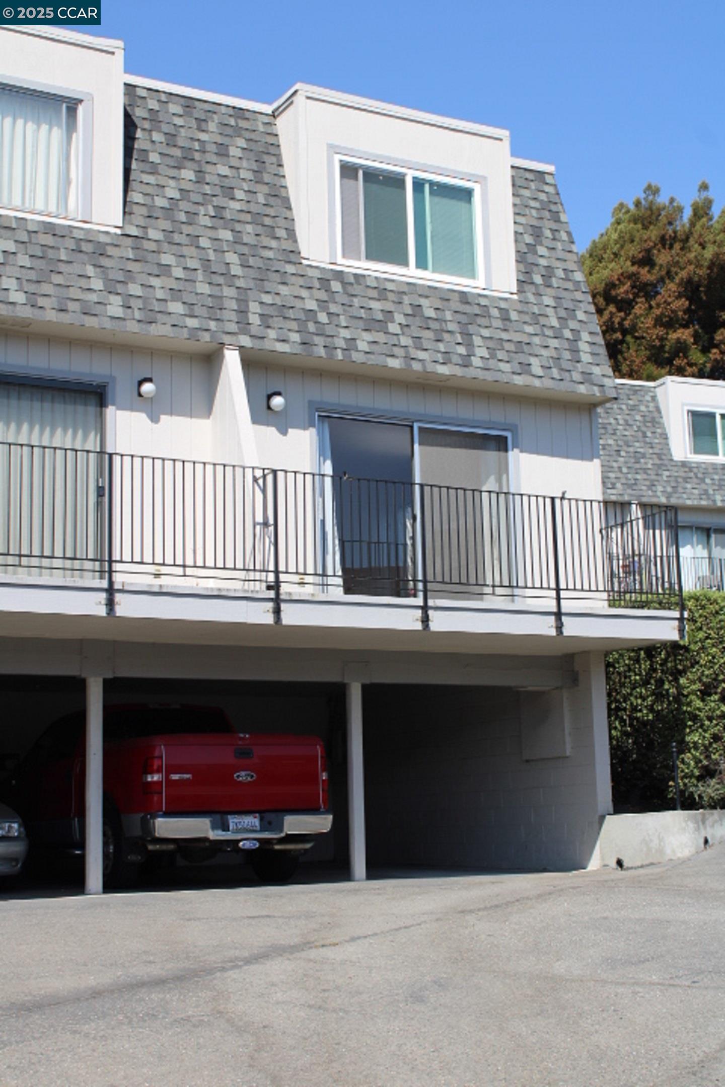 4811 Appian Way, Unit 3/5 El Sobrante, CA 94803 - Photo 26 of 27 a front view of a house with balcony