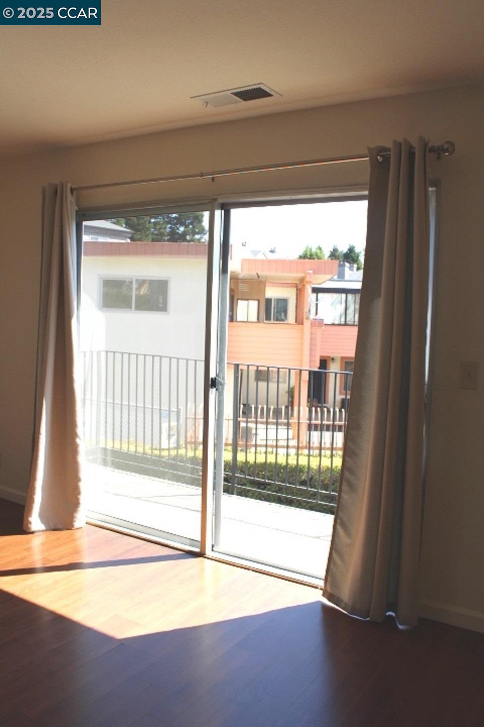 4811 Appian Way, Unit 3/5 El Sobrante, CA 94803 - Photo 4 of 27 a view of an empty room and a window