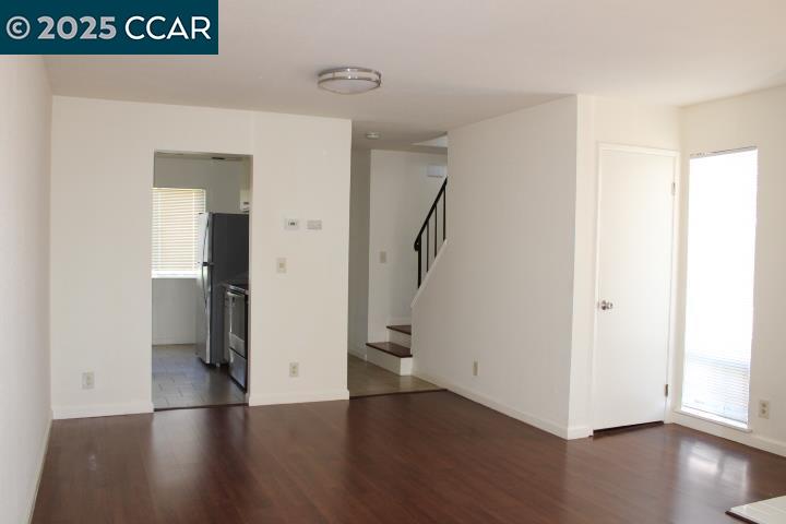 4811 Appian Way, Unit 3/5 El Sobrante, CA 94803 - Photo 7 of 27 a view of an empty room with wooden floor