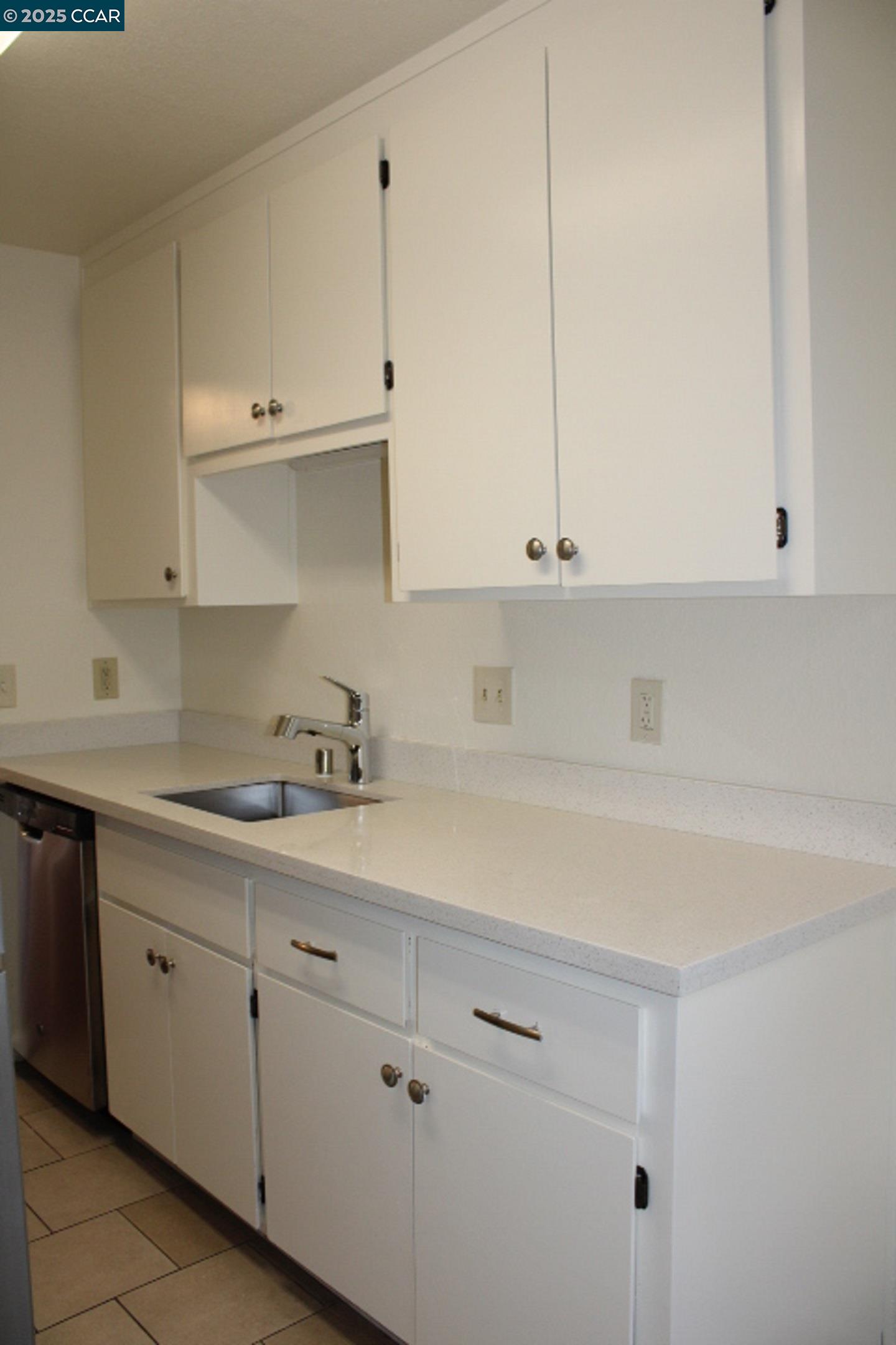 4811 Appian Way, Unit 3/5 El Sobrante, CA 94803 - Photo 10 of 27 a kitchen with cabinets appliances and a sink