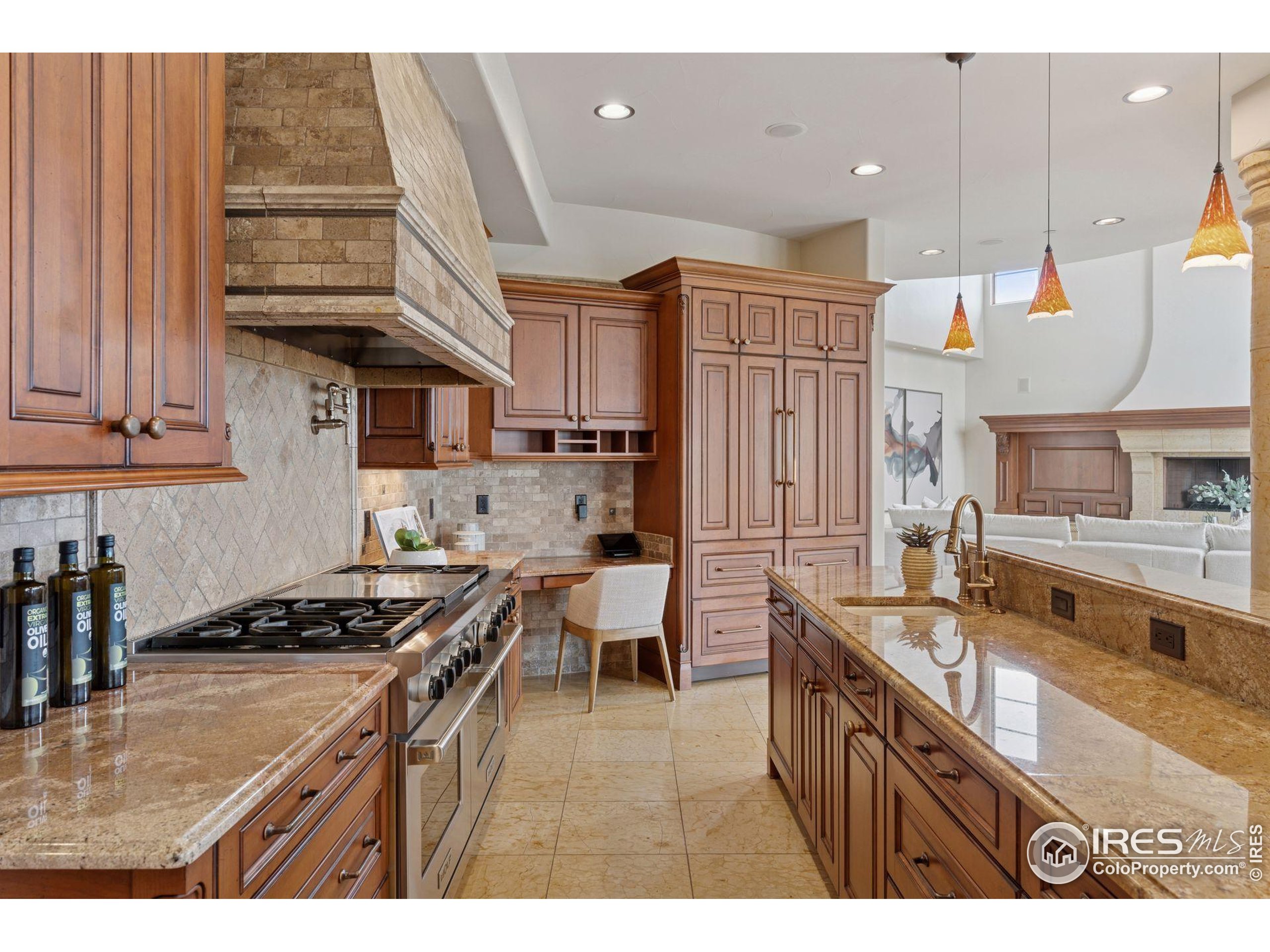 6541 Legend Ridge Trail Niwot, CO 80503 - Photo 15 of 45 a kitchen with stainless steel appliances granite countertop a stove a sink dishwasher and cabinets with wooden floor