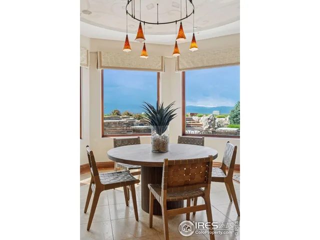 a large kitchen with stainless steel appliances a large counter tops and a view of living room