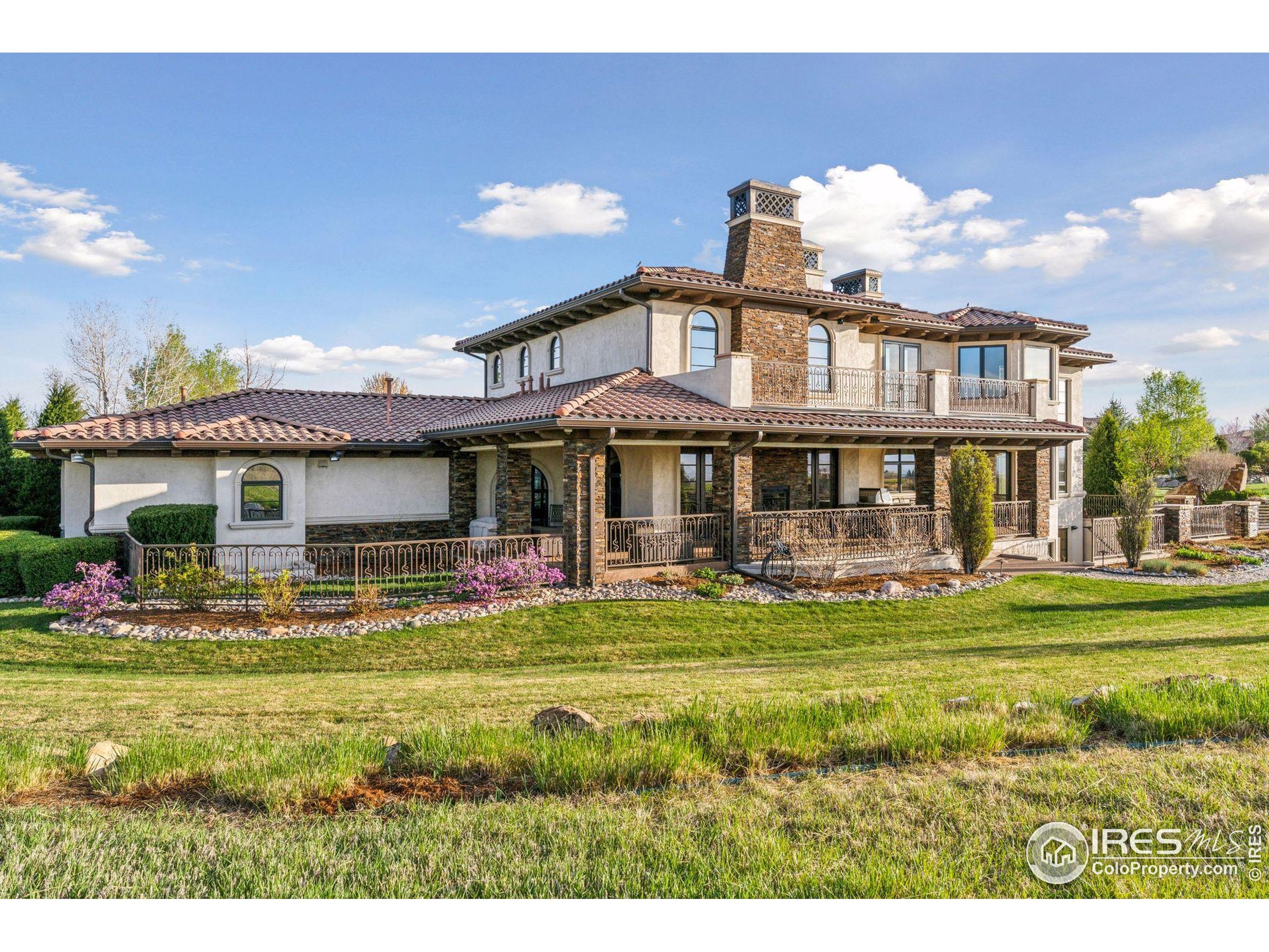 6541 Legend Ridge Trail Niwot, CO 80503 - Photo 22 of 45 a front view of a house with swimming pool having outdoor seating