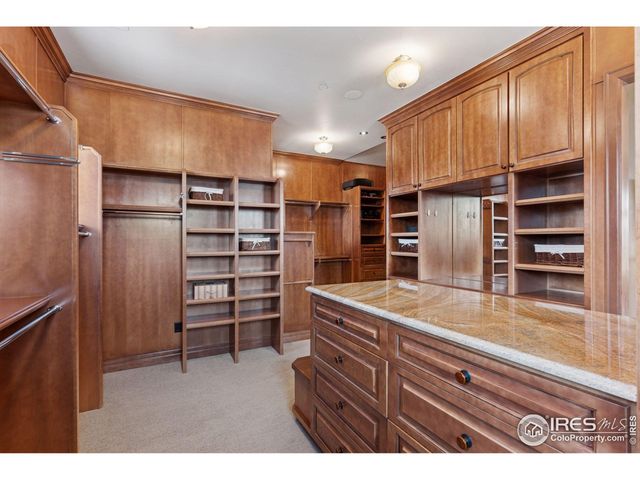 a kitchen with a refrigerator and cabinets