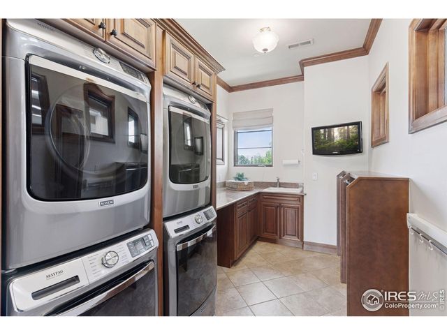 a kitchen with stainless steel appliances kitchen island a stove and a microwave