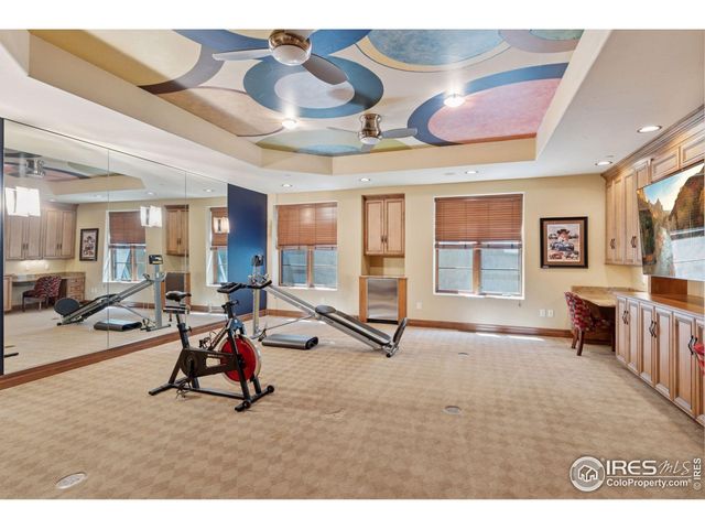 a view of a livingroom with furniture and a window