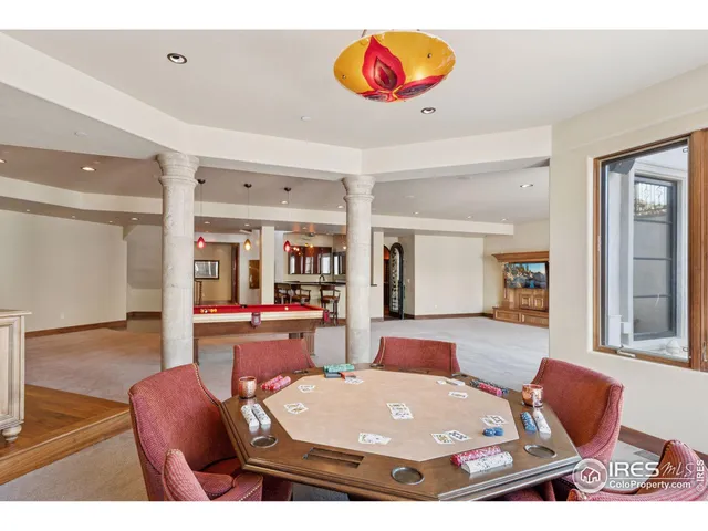 a view of a livingroom with furniture and a window