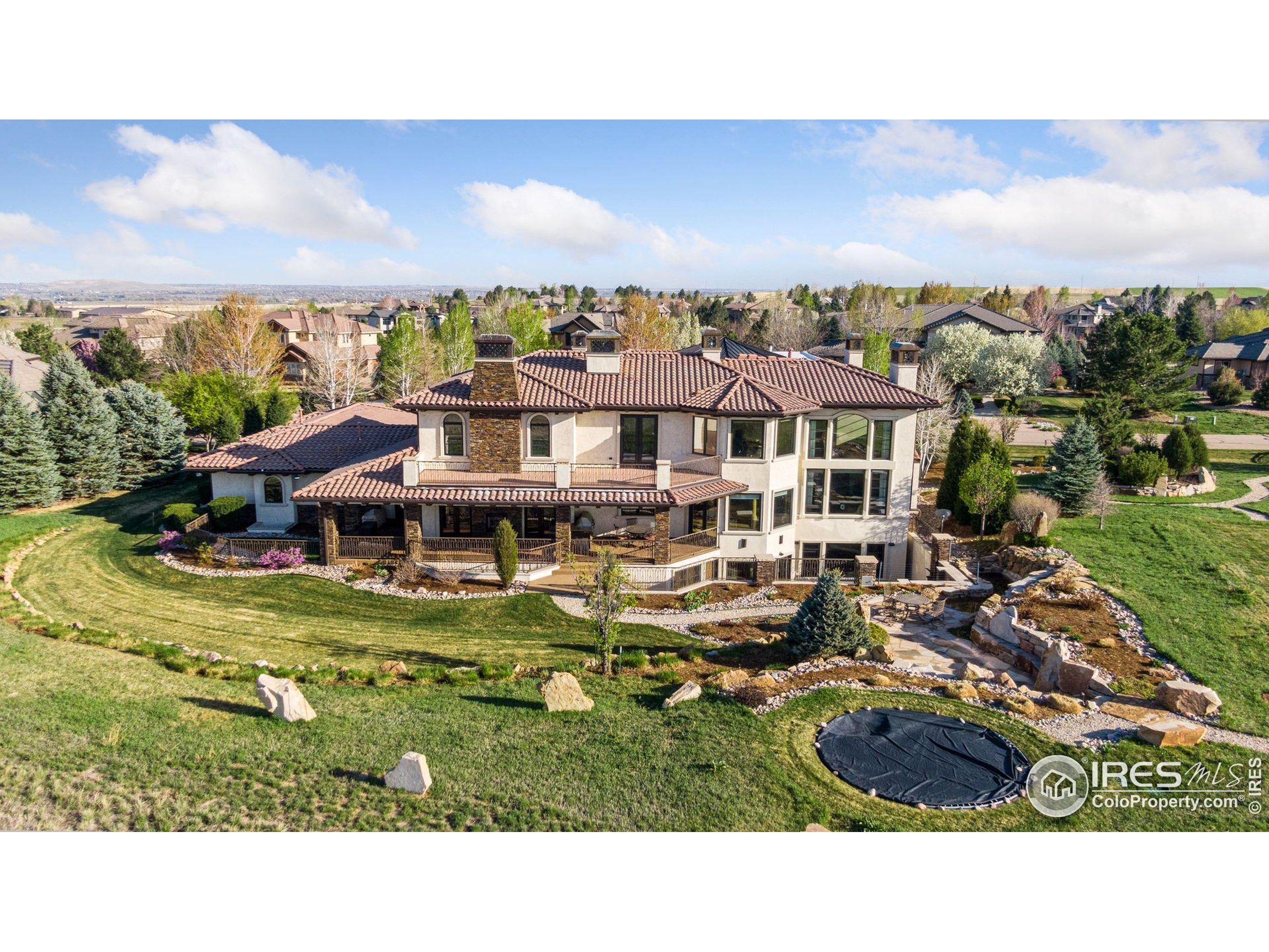 6541 Legend Ridge Trail Niwot, CO 80503 - Photo 7 of 45 a aerial view of a house with a garden