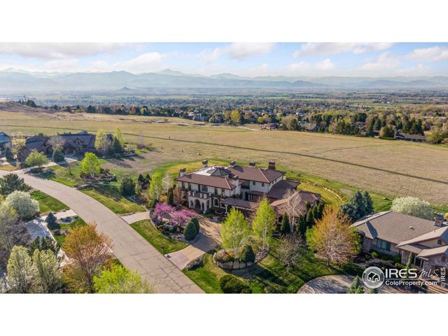 a view of a chairs and table in a terrace