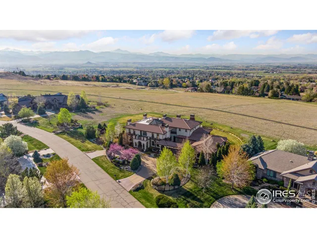 a view of a chairs and table in a terrace