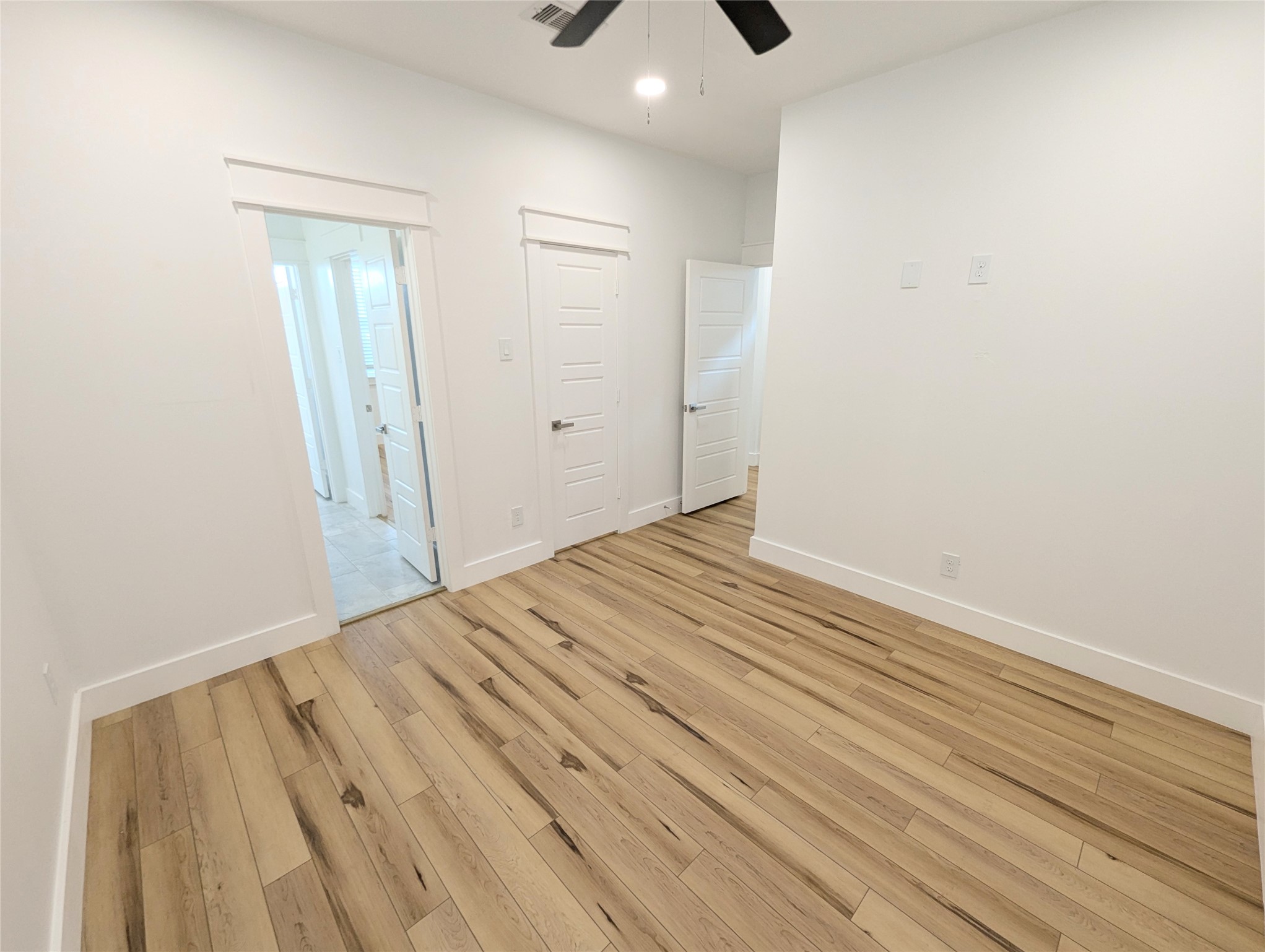 4913 Fisk Street Houston, TX 77009 - Photo 22 of 27 a view of an empty room with wooden floor