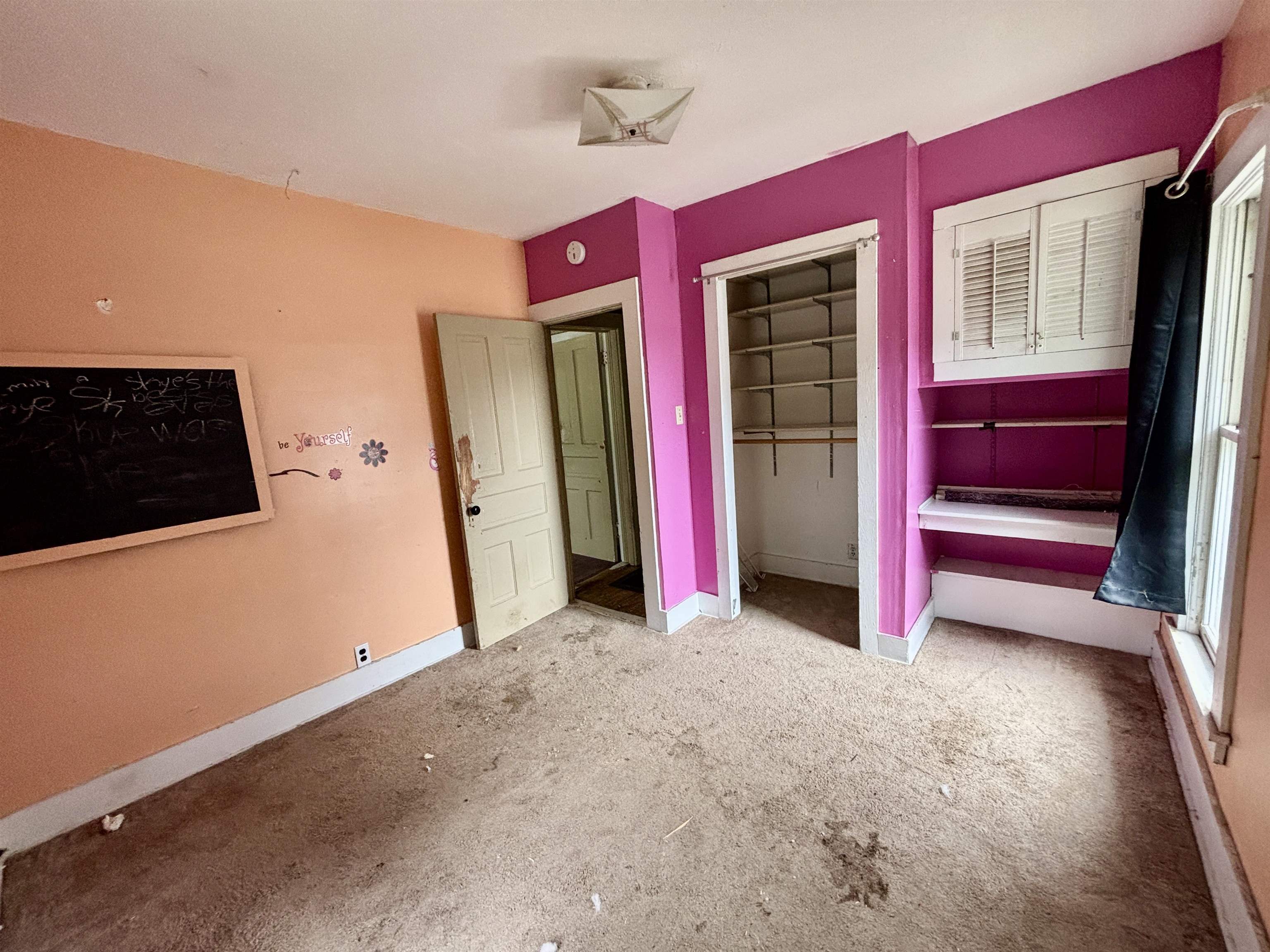 412 West Madison Street Belvidere, IL 61008 - Photo 23 of 27 a view of a livingroom with wooden floor and a kitchen