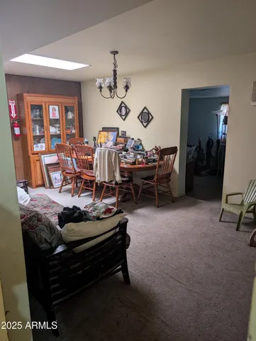 a kitchen with a table and chairs in it