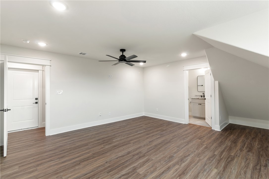 7822 Mathis Crk Drive Bryan, TX 77808 - Photo 31 of 43 wooden floor in an empty room with a window