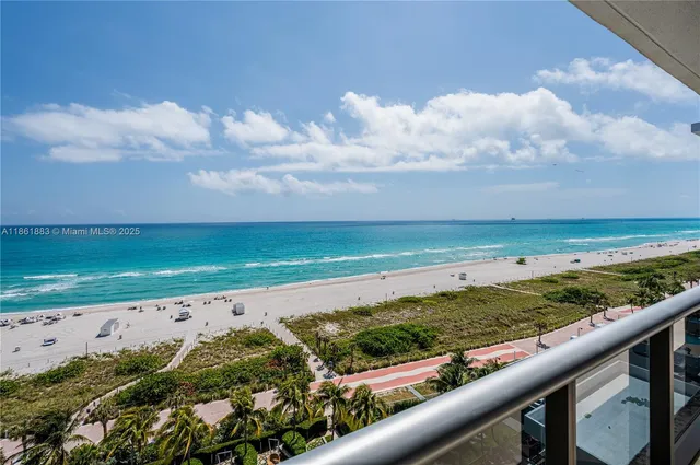 a kitchen with stainless steel appliances granite countertop a sink and a refrigerator