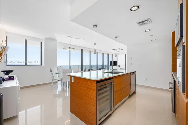 a kitchen with stainless steel appliances a sink and a stove