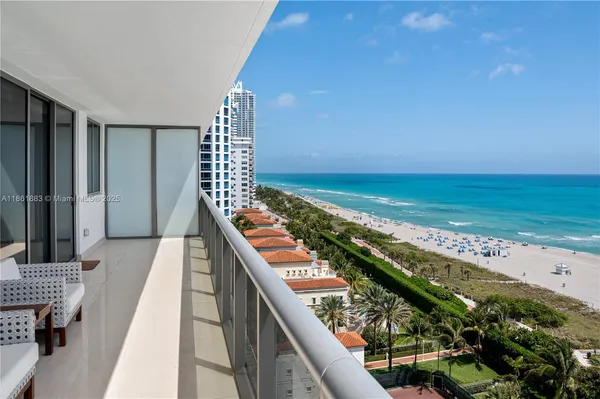 a view of a balcony with an ocean