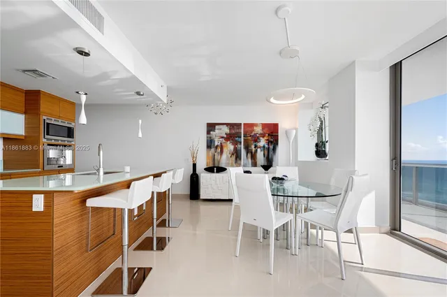 a kitchen with stainless steel appliances granite countertop a sink and a stove