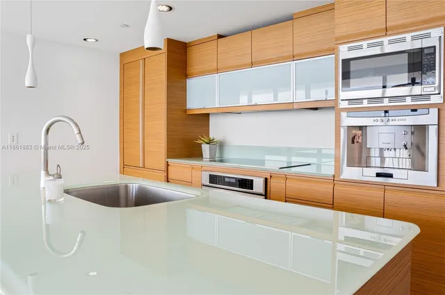 a bedroom with a bed and a table with lamp