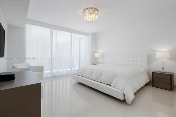 a bedroom with a bed and a night lamp