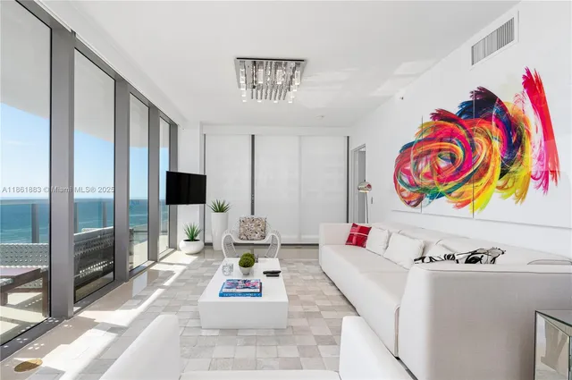 a living room with furniture and a table