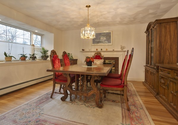 15 Montclair Road Newton, MA 02468 - Photo 4 of 12 a dining room with furniture a rug and a chandelier